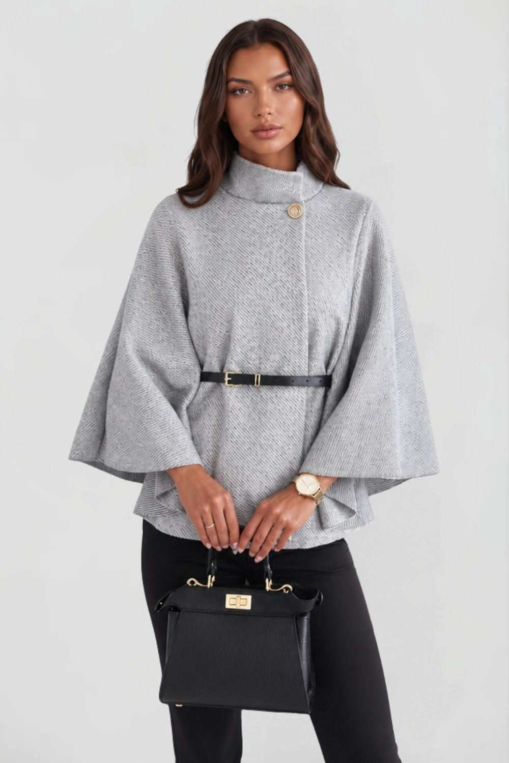 Front view of the light gray belted cape jacket with textured finish, high collar, and statement button.