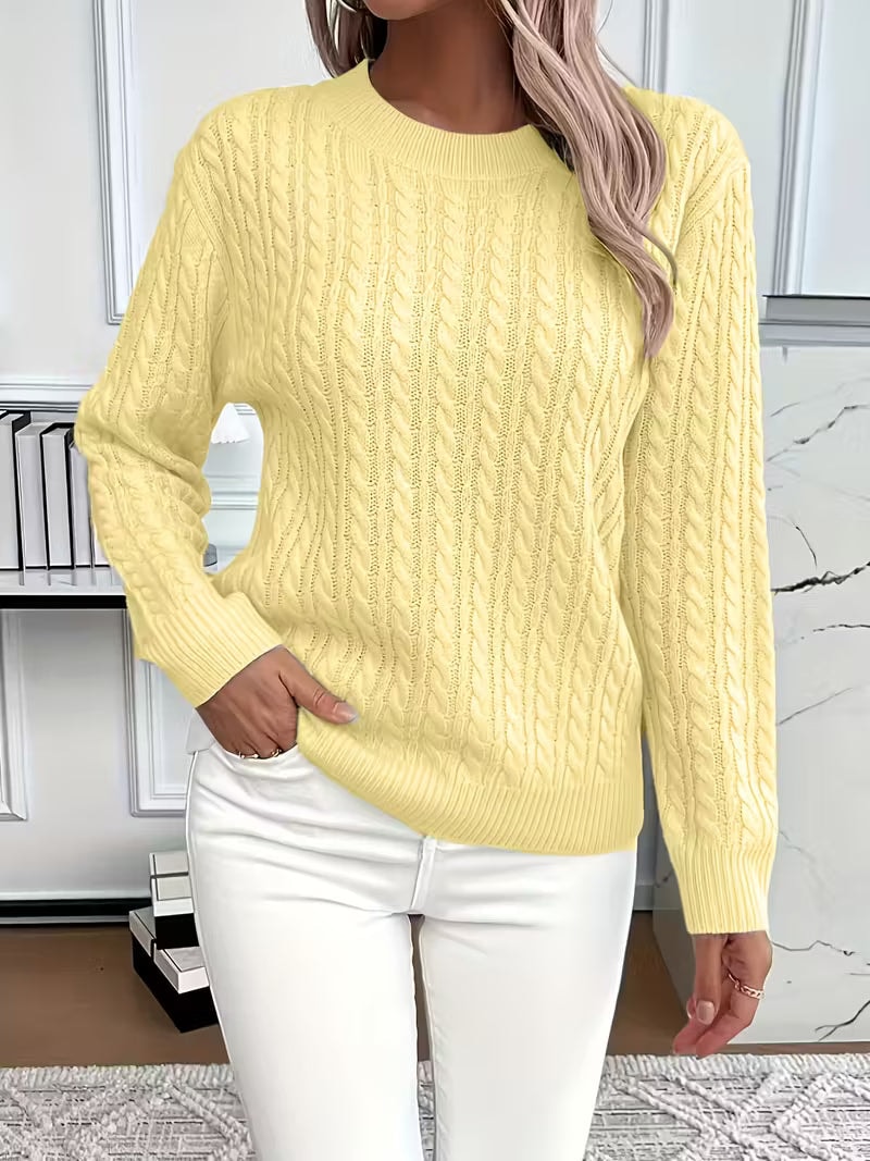 Yellow cable knit crew neck sweater shown front-facing with a ribbed neckline, hem, and cuffs.