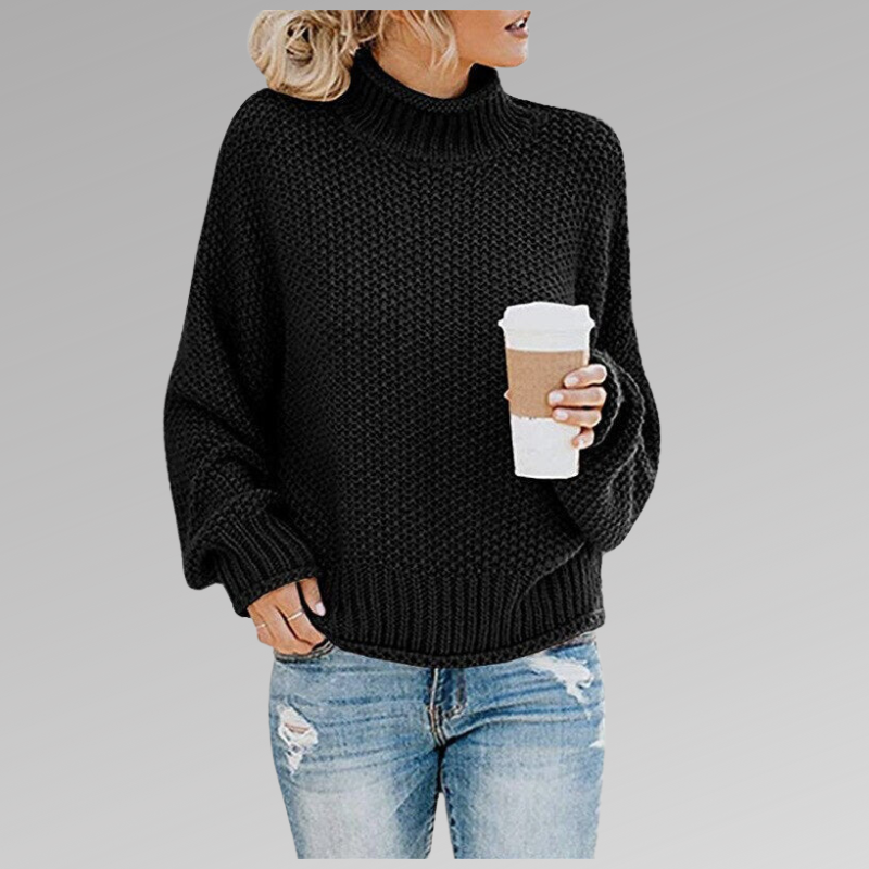 Black chunky knit sweater featuring a ribbed turtleneck, relaxed long sleeves and a ribbed hip-length hem.