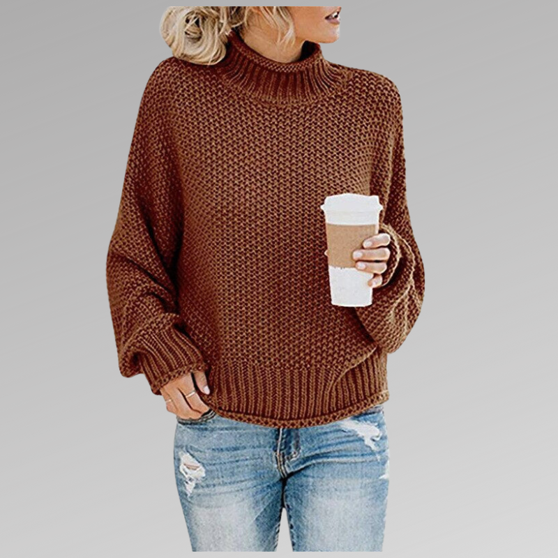 Deep brown chunky knit turtleneck sweater with textured stitching, loose sleeves and ribbed cuffs.