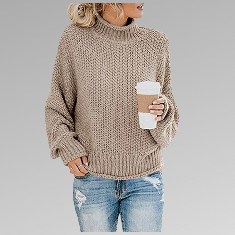 Taupe chunky knit turtleneck sweater with a textured pattern, relaxed fit and coordinating ribbed neckline and hem.