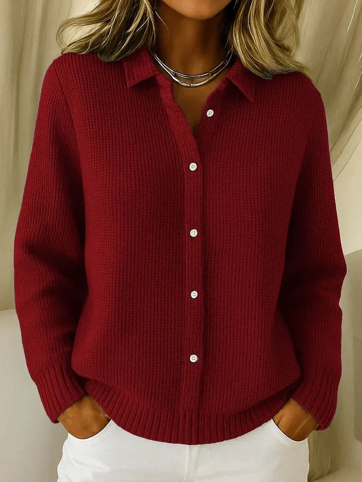 Deep red women's cardigan featuring a pointed shirt collar, visible button placket, relaxed long sleeves, and ribbed trim.