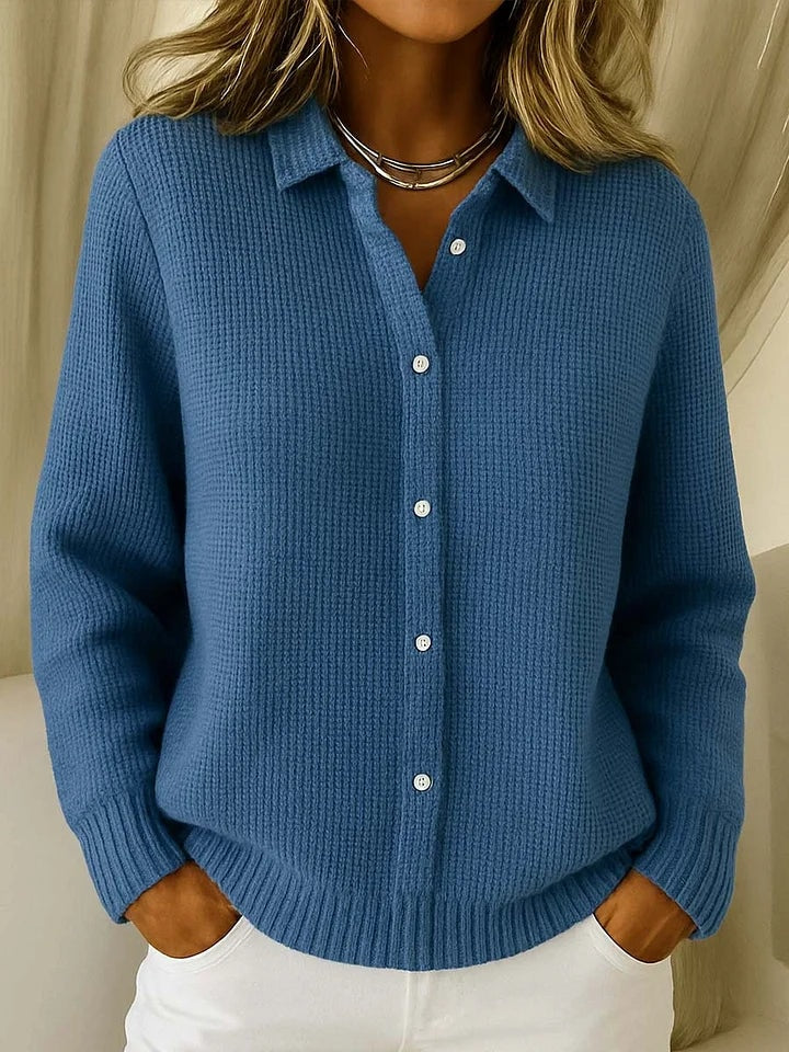 Dark blue button-front cardigan with a shirt-inspired collar, long sleeves, ribbed cuffs, and a relaxed hip-length silhouette.
