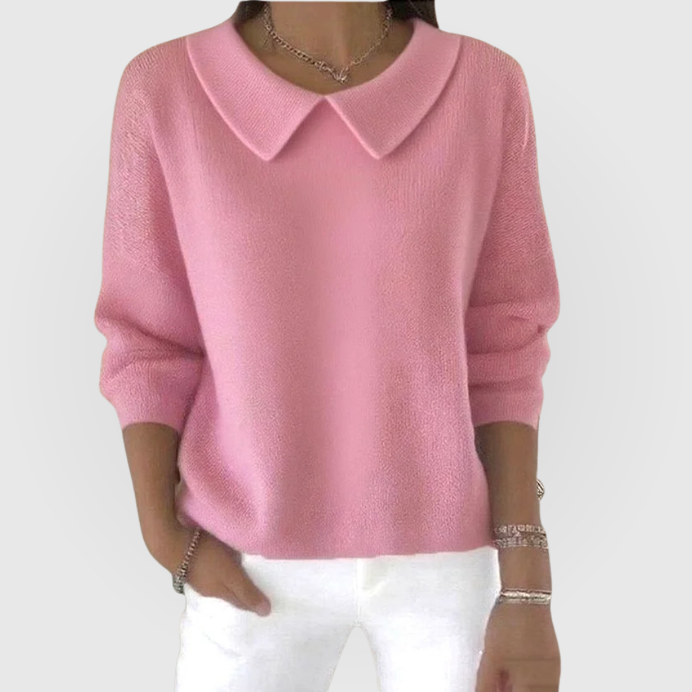 Pink everyday sweater with a rounded pointed collar, relaxed long sleeves, fitted cuffs, and a hip-length hem.