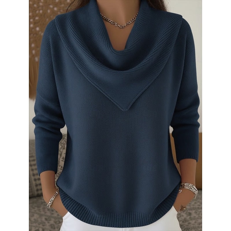 Front view of the cowl neck sweater in navy blue, with long sleeves and a ribbed curved hem.
