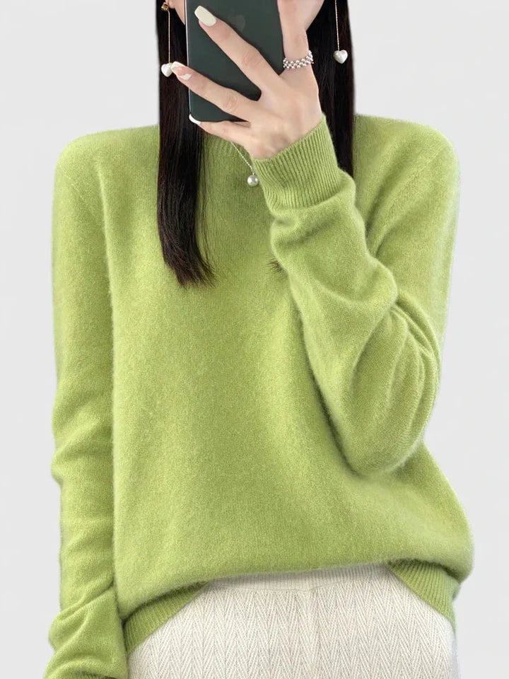 Lime green crew neck sweater against a plain background, with long sleeves and ribbed cuffs.