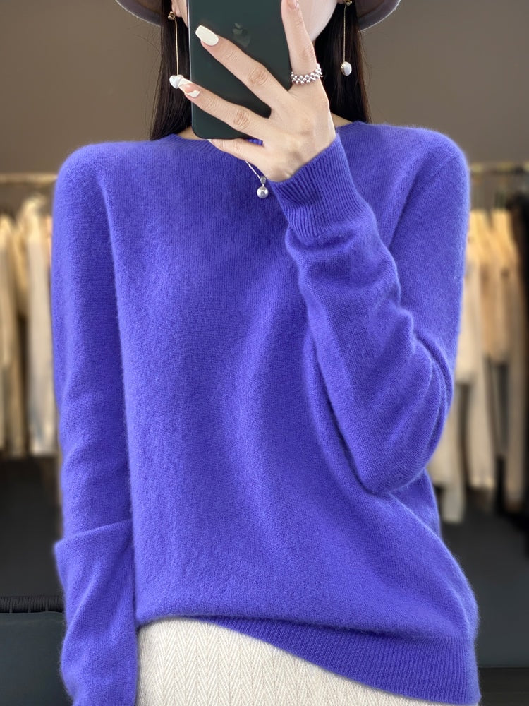 Bright violet crew neck sweater with a clean front, long sleeves, and ribbed sleeve cuffs.