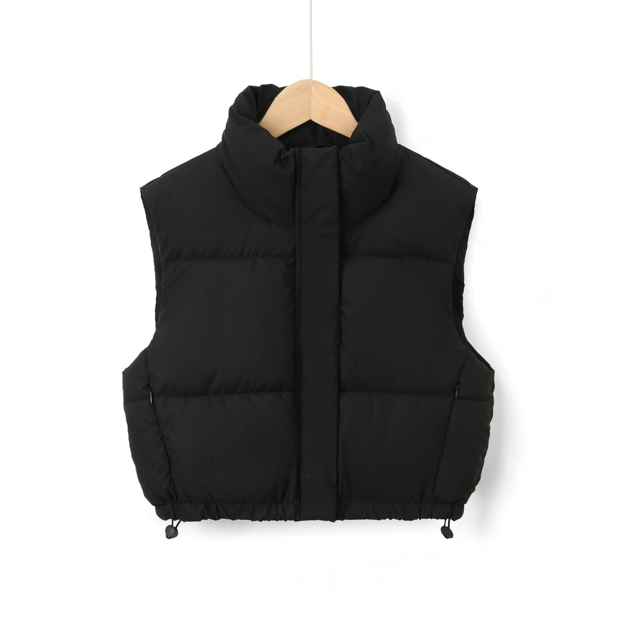 Black cropped quilted vest with a streamlined front closure and adjustable drawstring details at both sides of the hem.