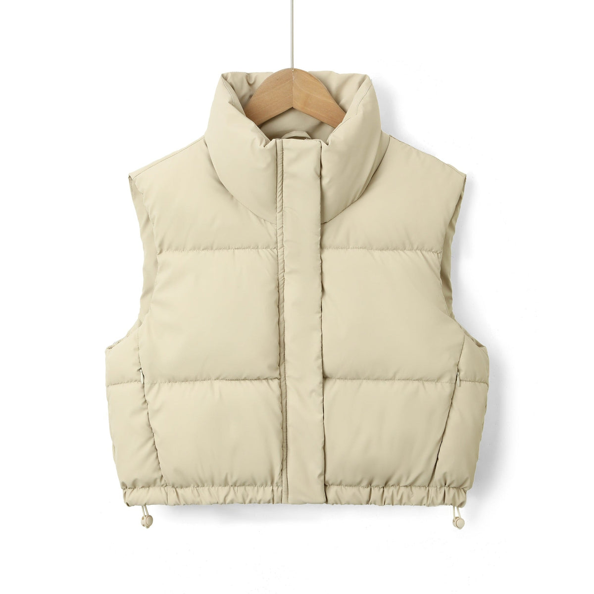 Pale cream sleeveless puffer vest with a raised collar, horizontal quilting, and relaxed adjustable hem.
