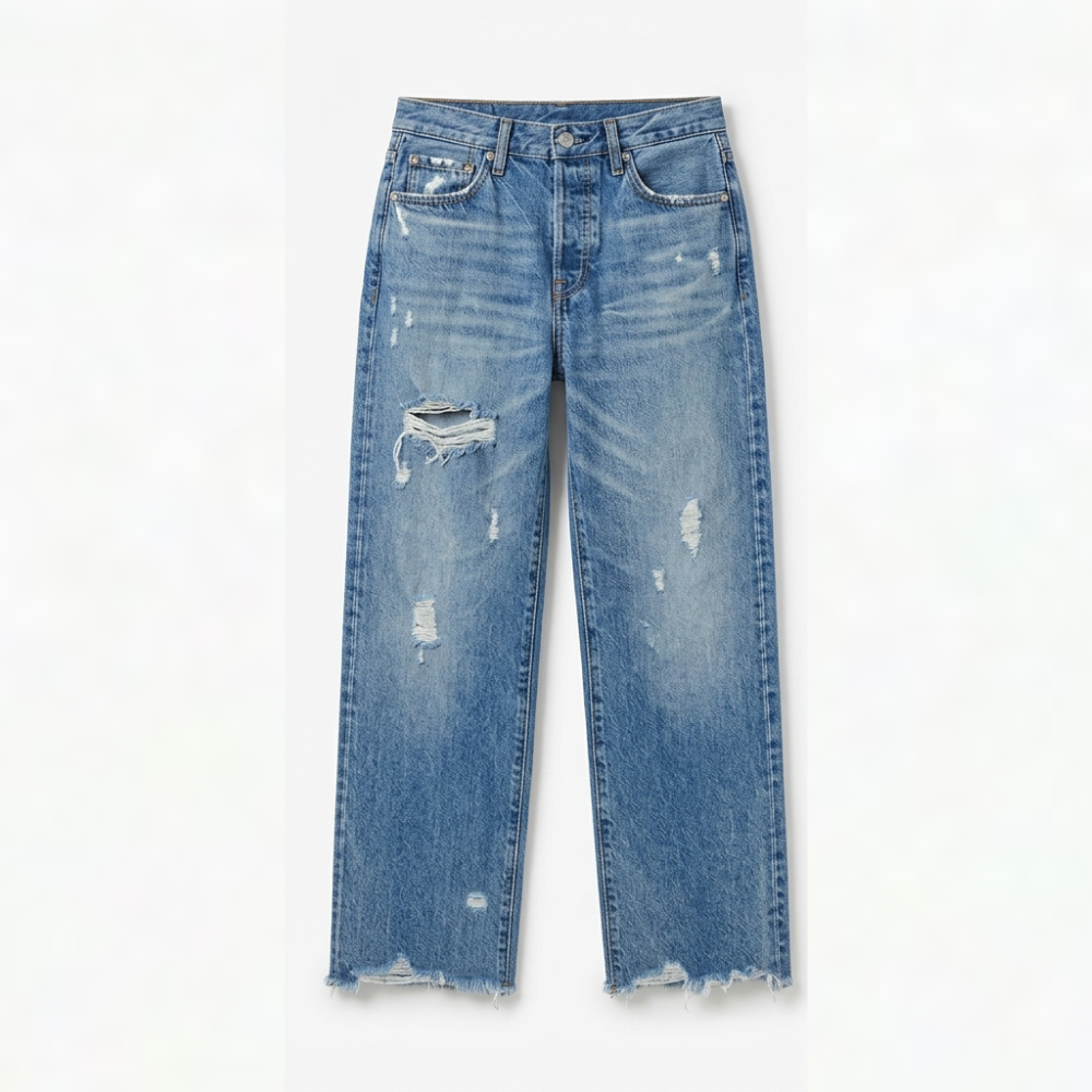 Full front view of light blue cropped jeans with prominent distressed thigh details and frayed hems.