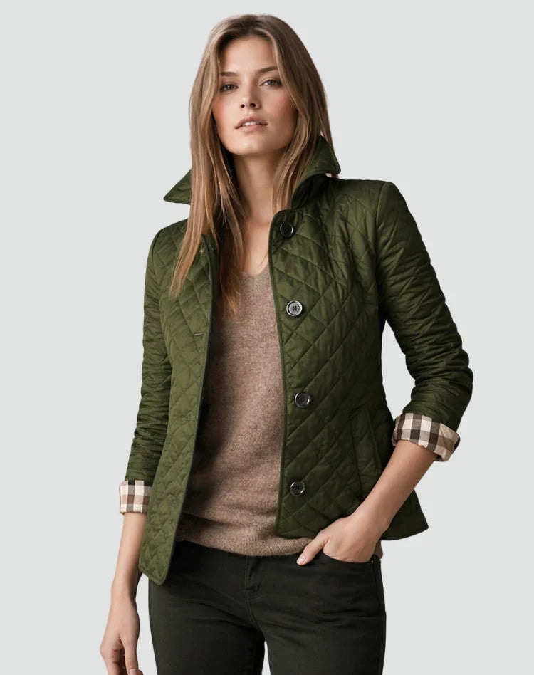 Olive green diamond-quilted button-front jacket with a raised collar, long sleeves, and side pockets, worn over a brown top and black trousers.