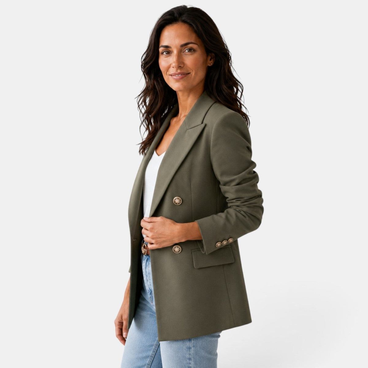 Three-quarter view of the olive green blazer showing the overlapping front, notch lapel, flap pocket, and decorative cuff buttons.