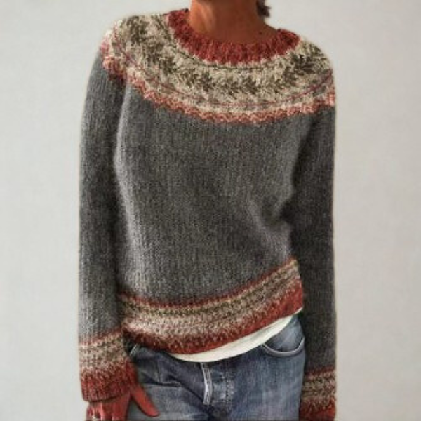 Charcoal Fair Isle crew neck sweater with muted cream and rust patterned bands at the neckline, hem, and cuffs.