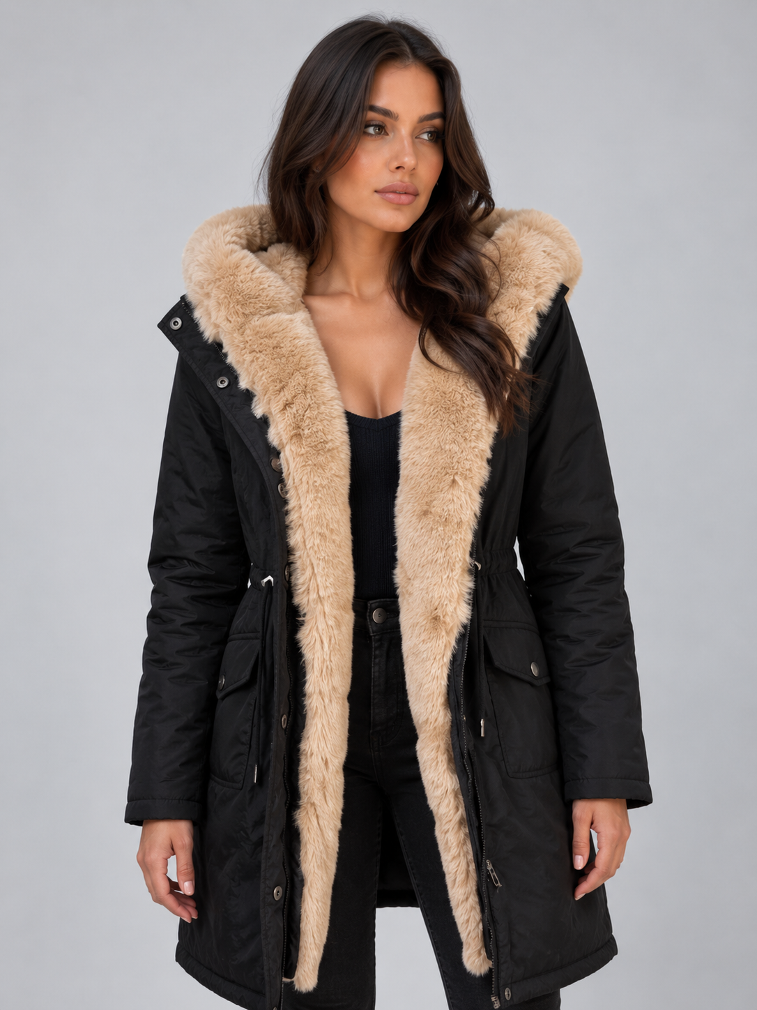 Open front view of the black parka displaying the plush hood lining, inner front panels, drawstring waist, and flap pockets.