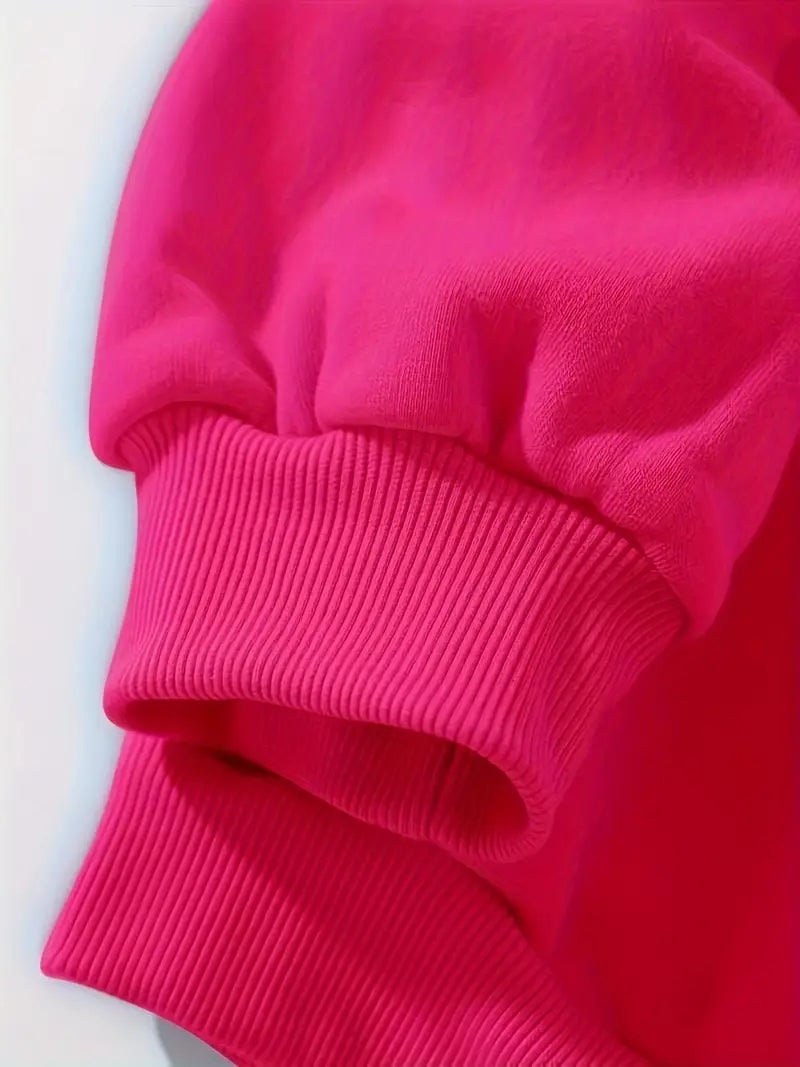 Close-up of the sweatshirt’s ribbed sleeve cuff and matching ribbed hem detail.