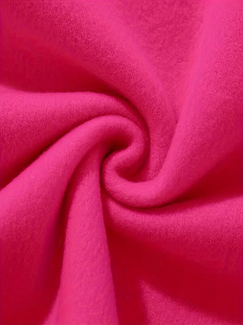 Close-up of the bright pink sweatshirt fabric gathered into soft folds.