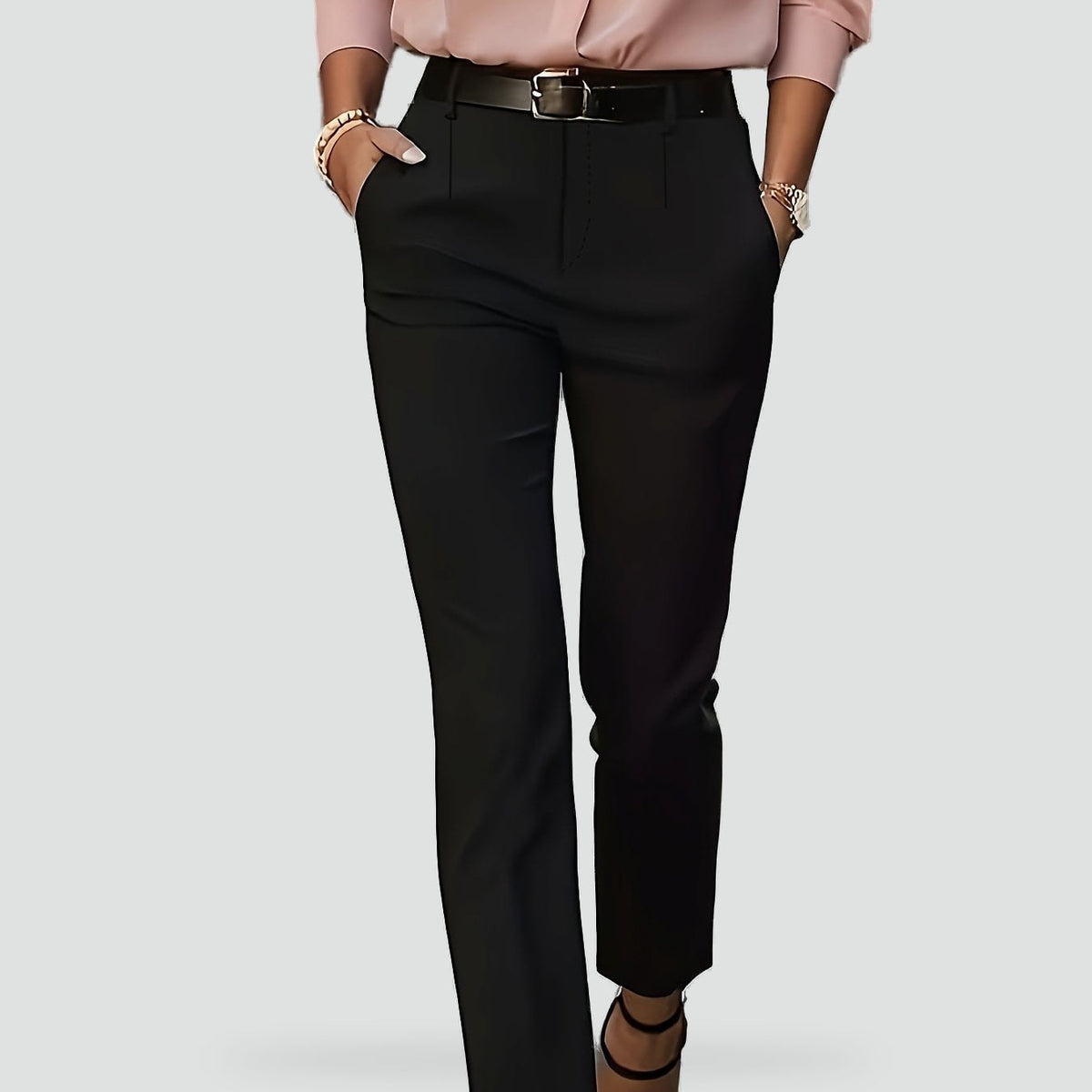 Black high-waisted slim-fit trousers shown from the front with angled pockets and ankle-length hems.