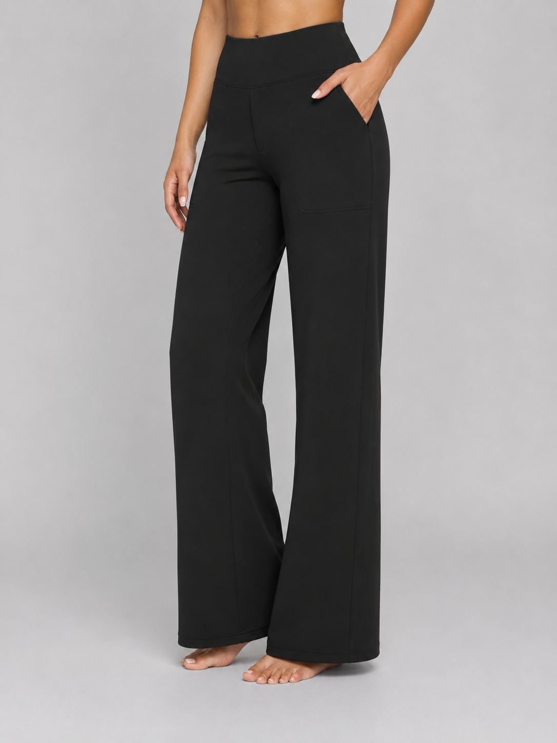 Front view of the wide-leg trousers in black, showing the high waistband and relaxed drape.