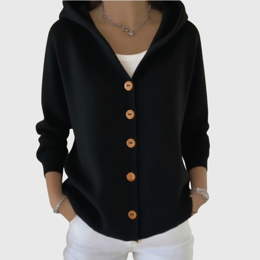 Black hooded cardigan with contrasting light buttons, long sleeves, and a curved front hem.