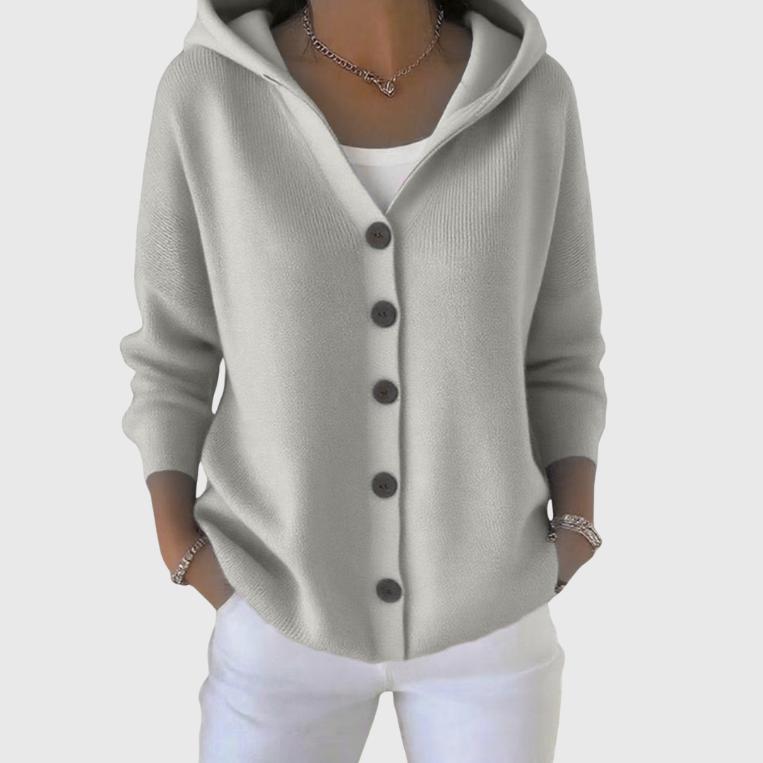 Light gray hooded button-front cardigan shown with its hood open and sleeves pushed slightly up.