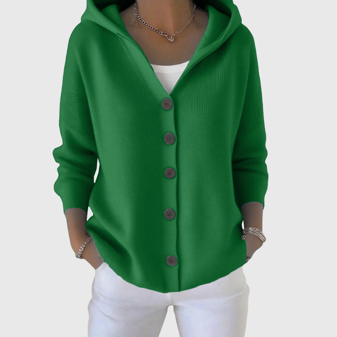 Green hooded button-front cardigan with a relaxed fit and long sleeves, styled over a white top.