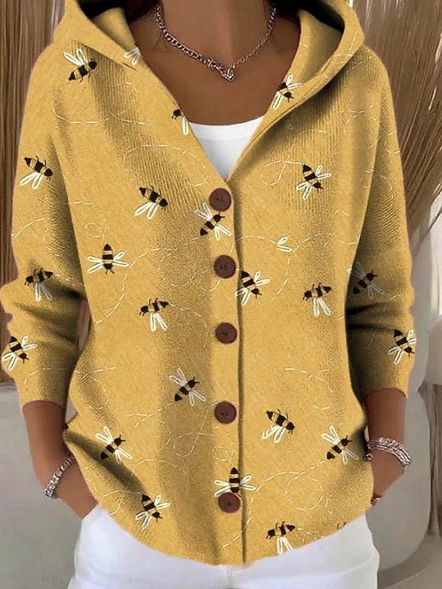 Mustard-yellow hooded button-front cardigan decorated with scattered bee illustrations.