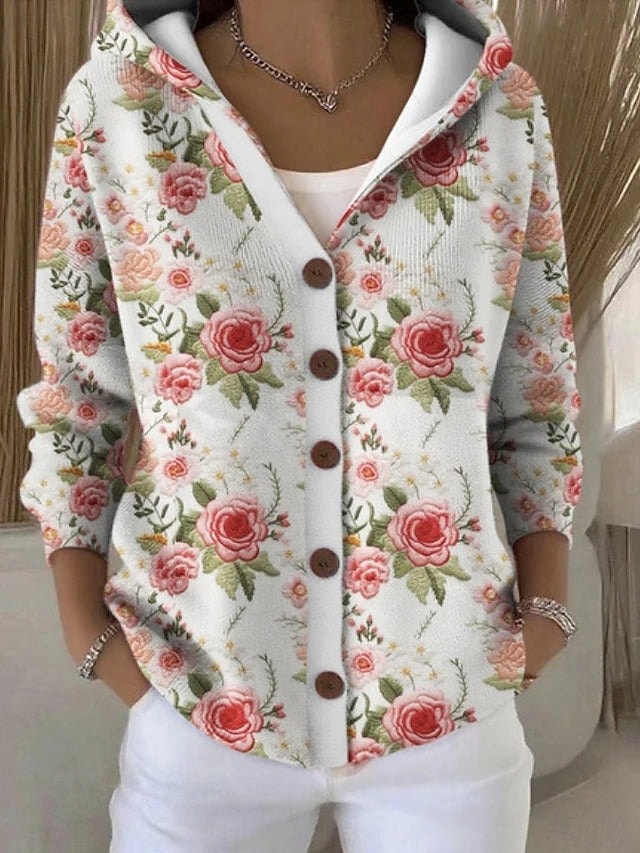White hooded button-front cardigan with an all-over pink rose and green leaf print.