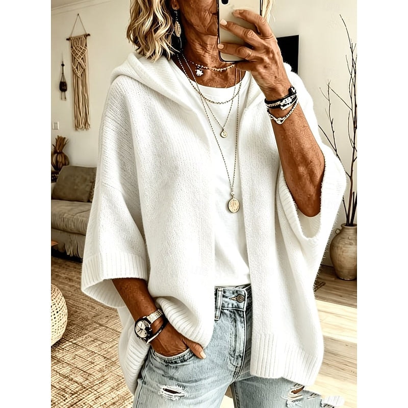 White hooded open-front cardigan layered over a white top, shown from the front with wide three-quarter sleeves and ribbed edging.