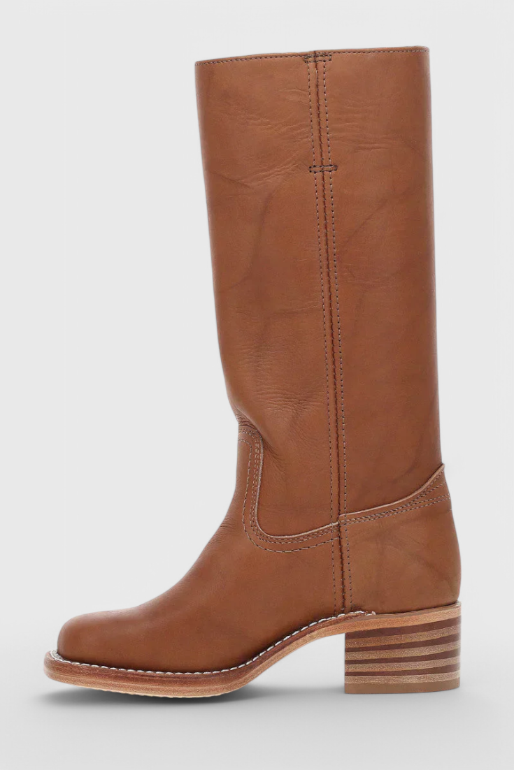 Brown knee-high boot shown from the opposite side, emphasizing the straight shaft seam and low stacked block heel.