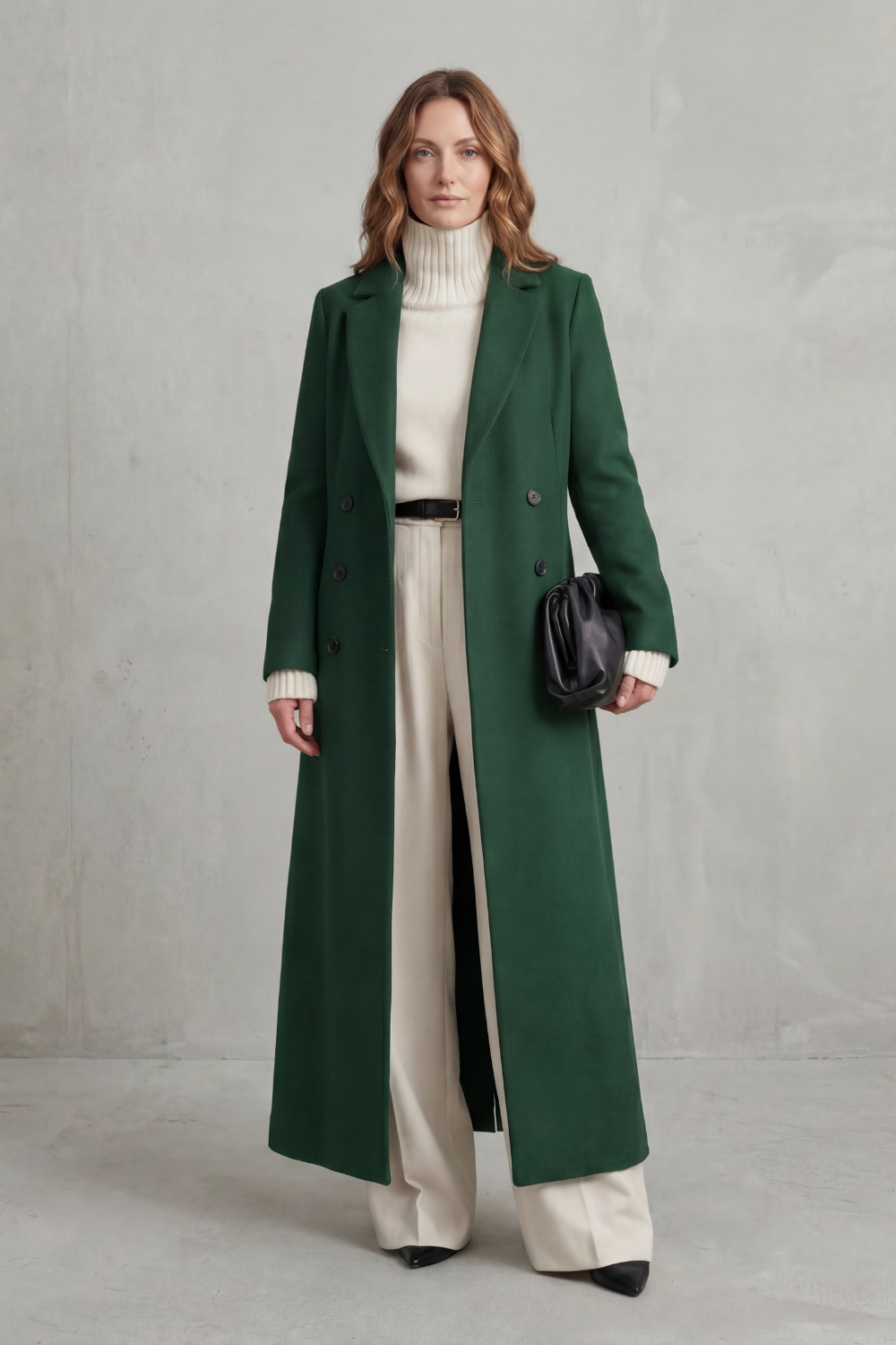 Dark green tailored coat shown from the front, with long sleeves, two button columns, and a streamlined hem.