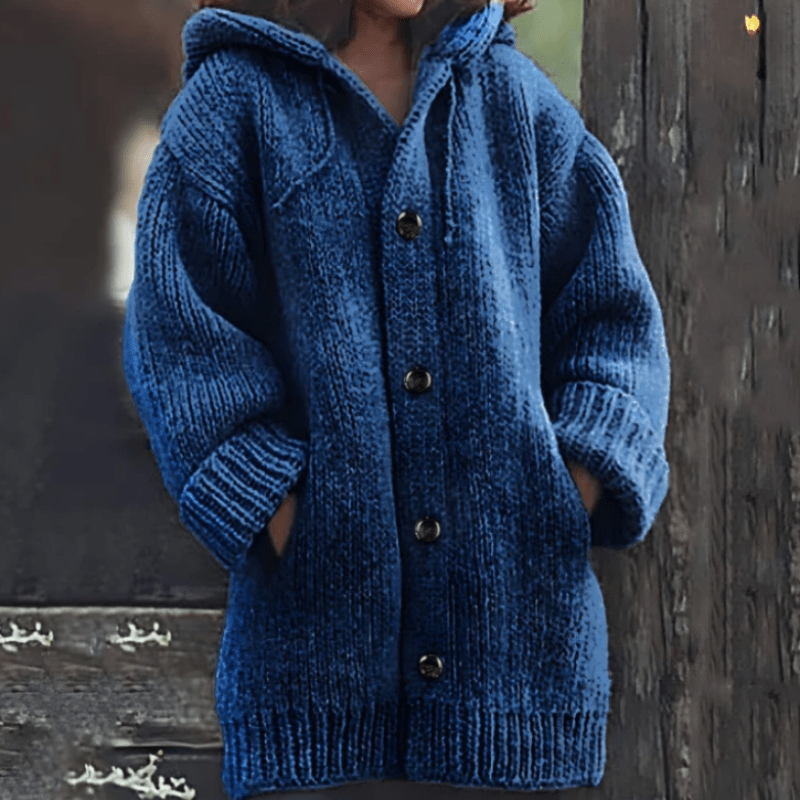 Dark blue long hooded cardigan displaying its textured knit surface, button fastening, ribbed cuffs, and hem.