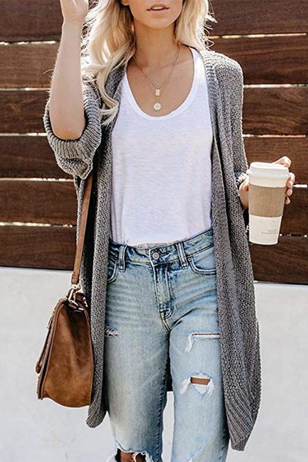 Full front view of the gray open-front cardigan with long sides and rolled-up relaxed sleeves.