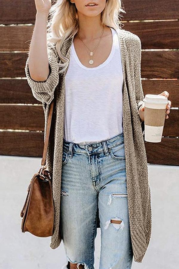 Light taupe open-front cardigan with relaxed sleeves worn over a white top and distressed jeans.