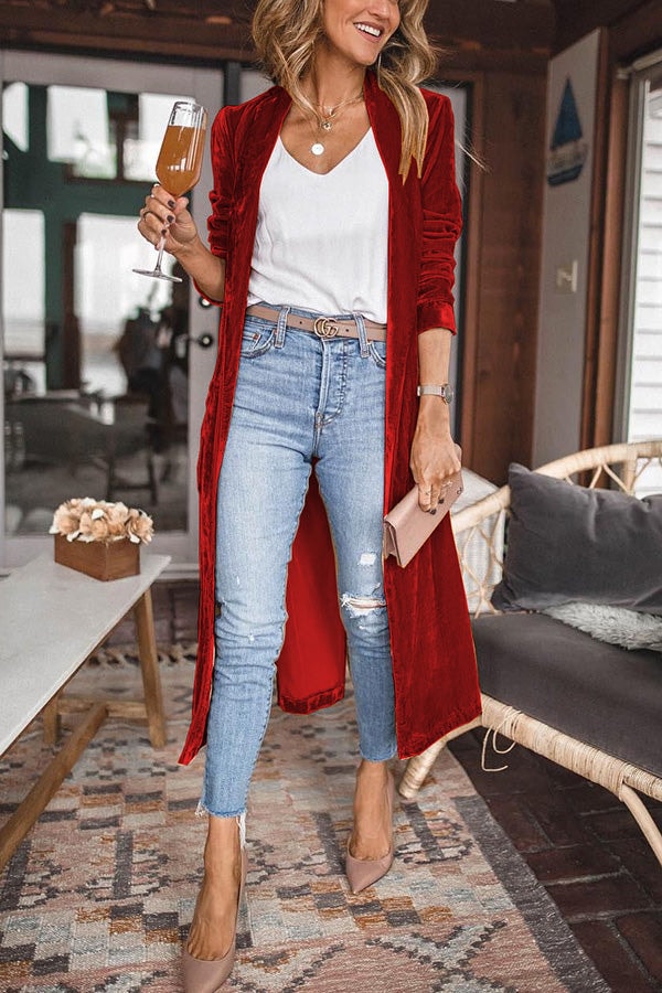 Red longline kimono coat showing its open front and gathered sleeves over a casual white top and jeans.