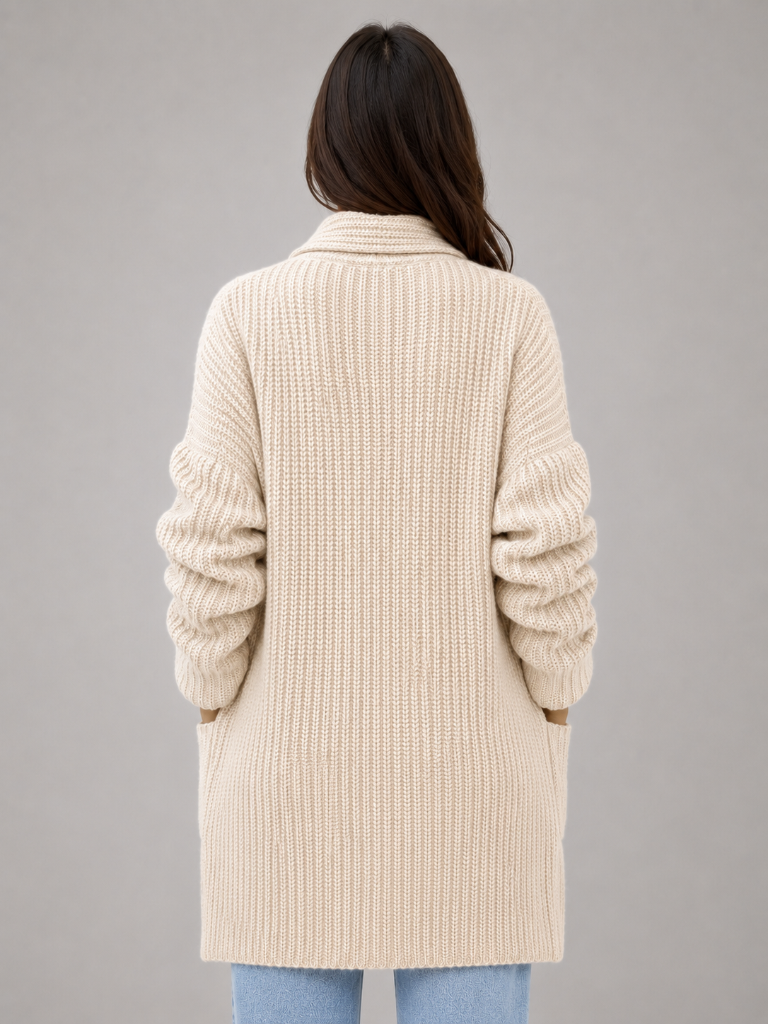 Back view showing the cardigan’s long, relaxed silhouette, textured knit appearance, and full-length sleeves.