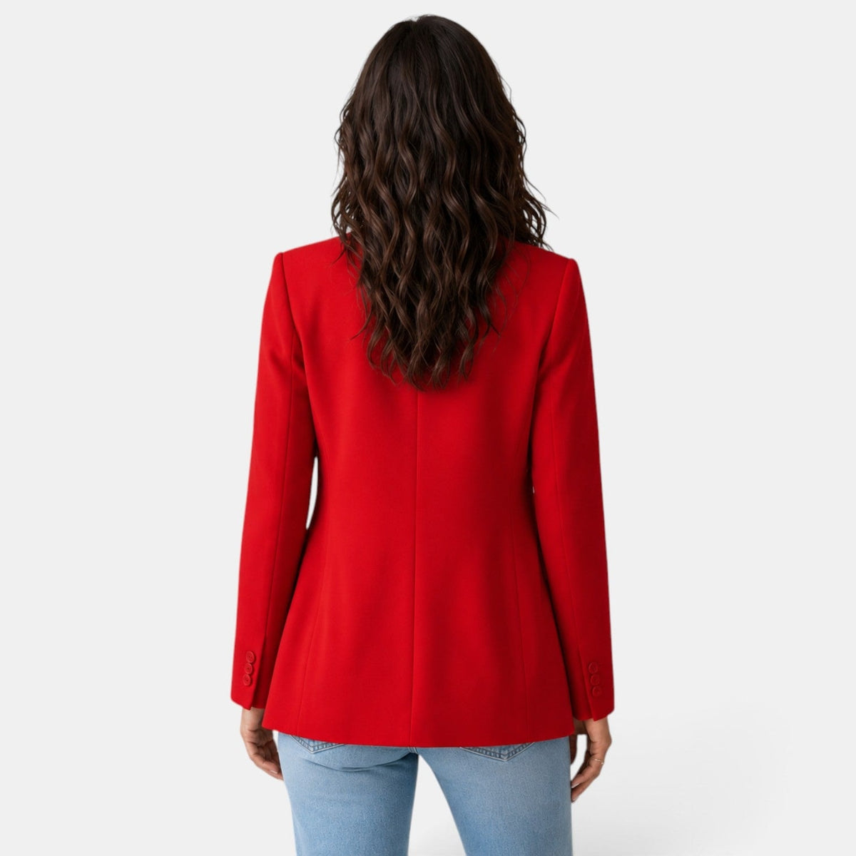 Back view of the red blazer highlighting the center seam, structured shoulders, and gently shaped silhouette.