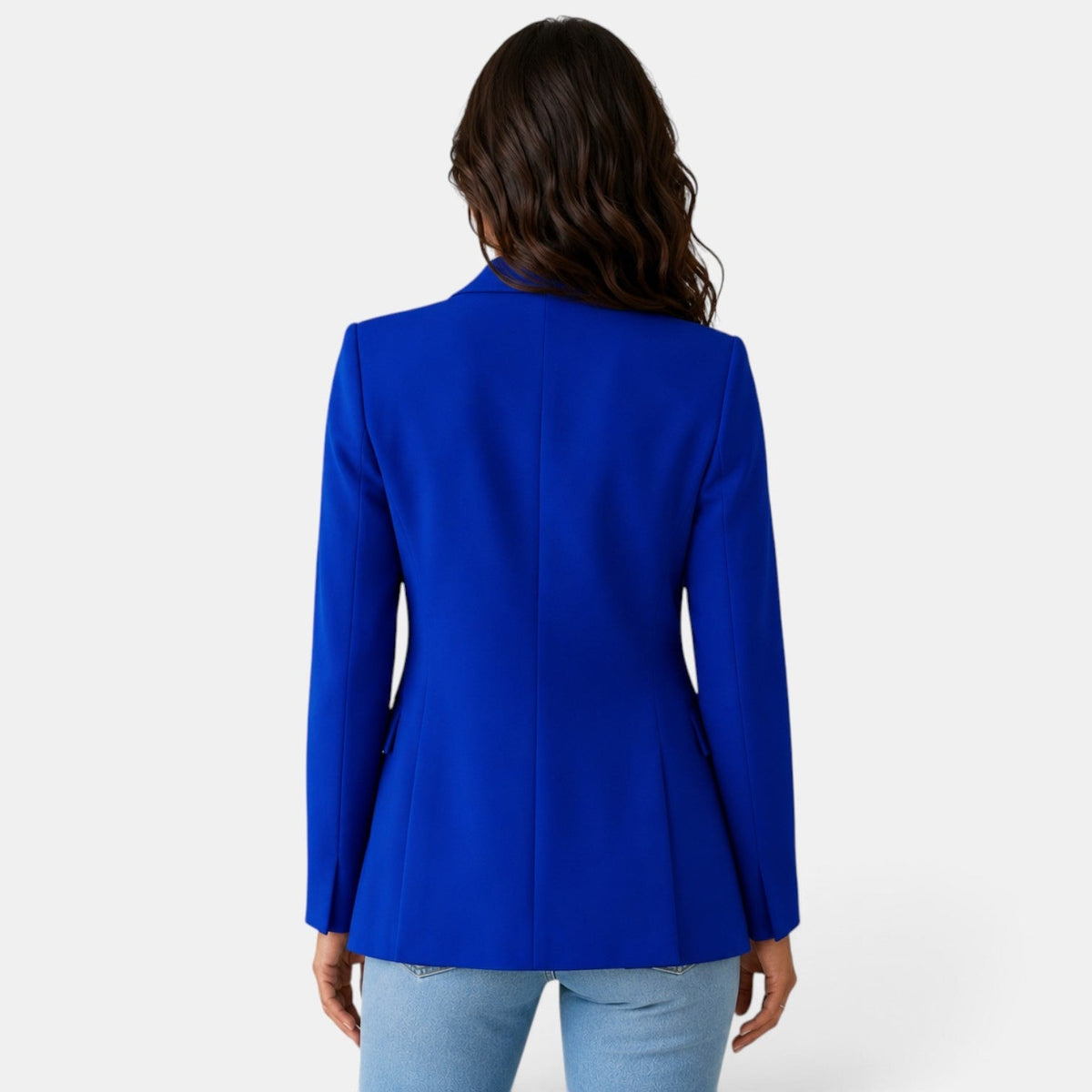 Back view of the blue blazer highlighting the center seam, structured shoulders, and straight tailored silhouette.