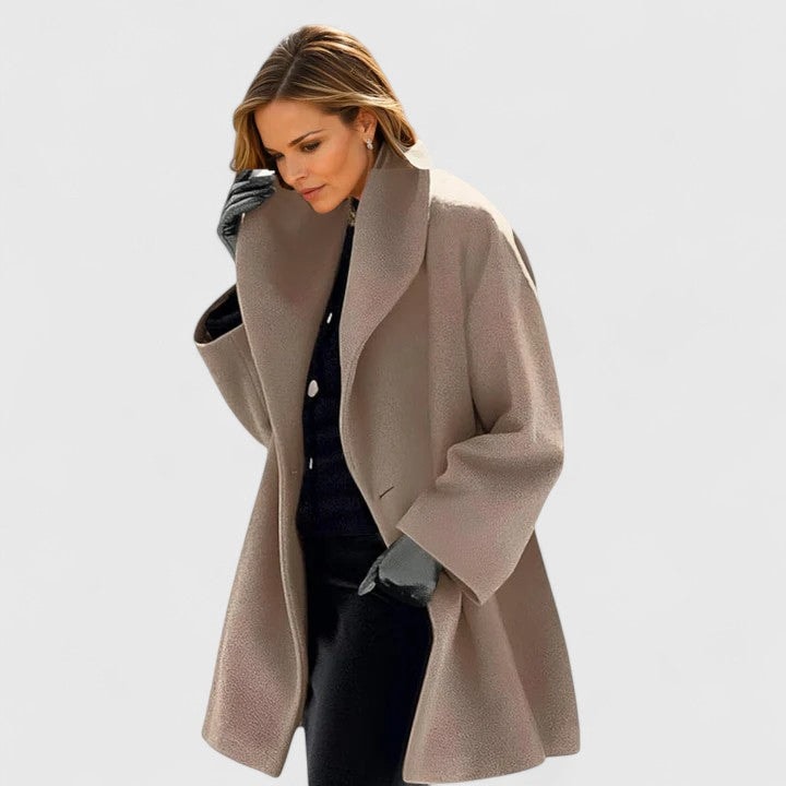 Taupe oversized coat shown open, highlighting its wide collar and gently flared lower shape.