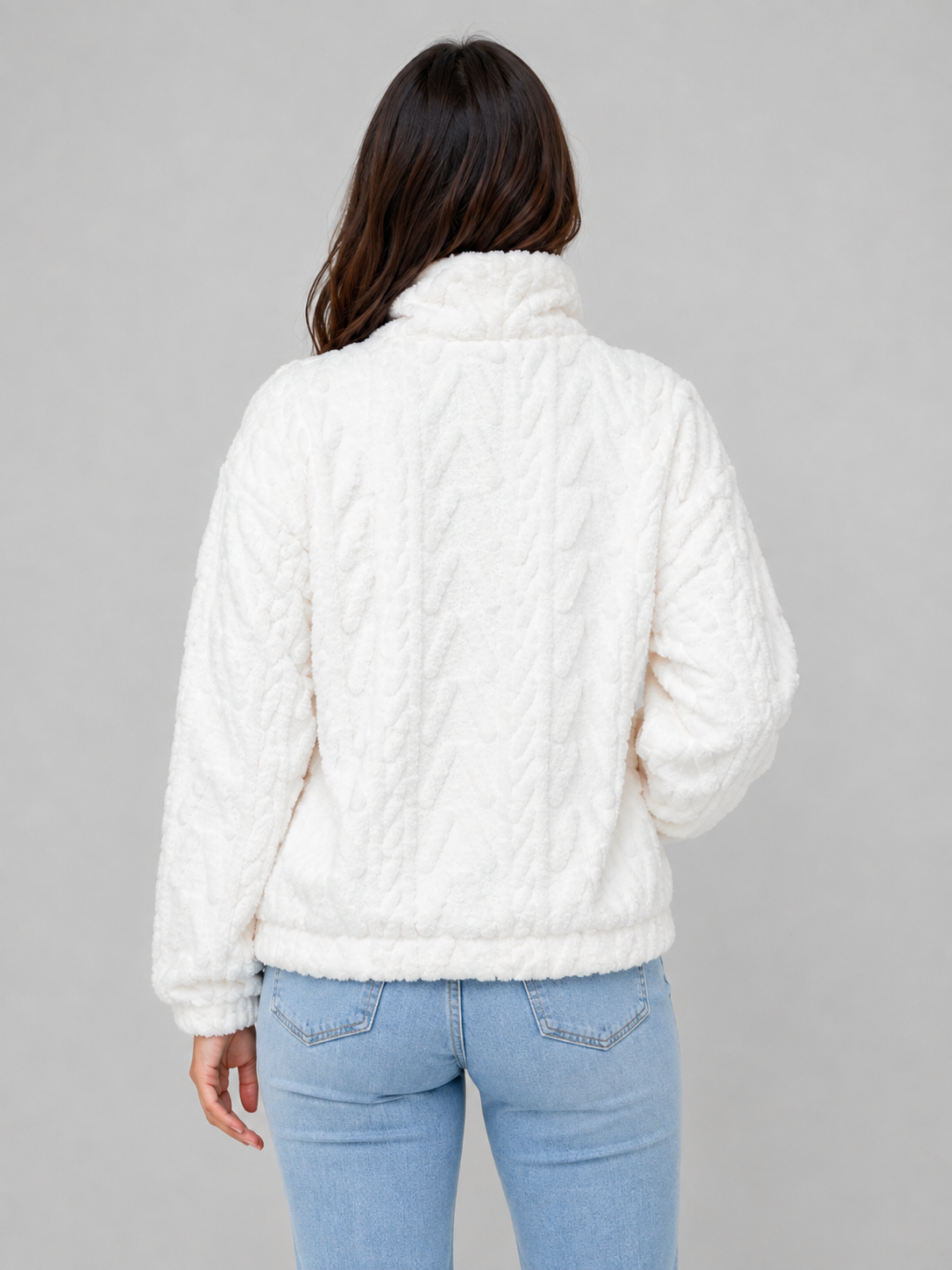 Back view of the white plush pullover showing its high collar, long sleeves, and relaxed fit.