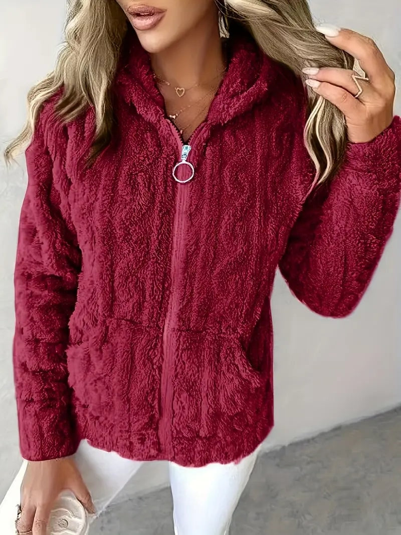 Burgundy plush jacket featuring a hood, ring-pull front zipper, and two patch pockets.