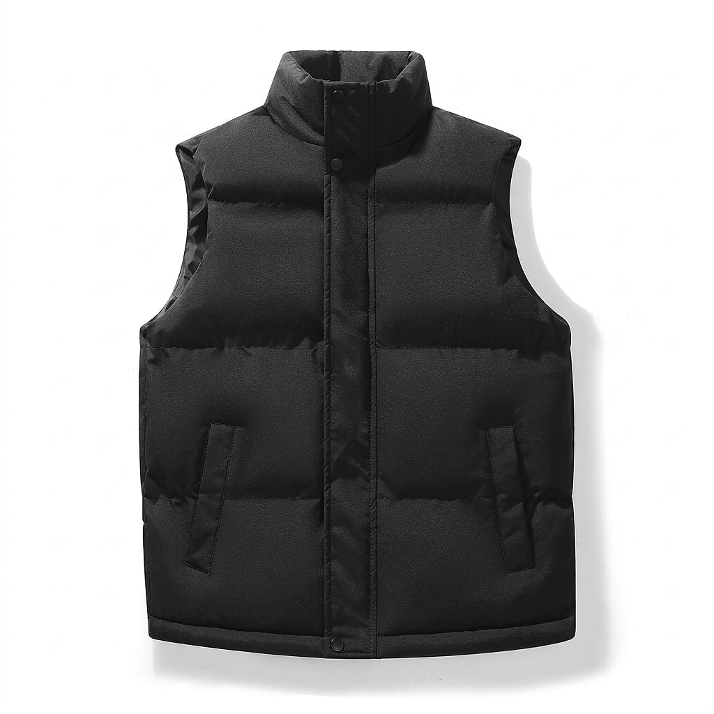 Black puffer vest shown from the front with its collar fastened, concealed closure, padded horizontal panels, and pocket openings.