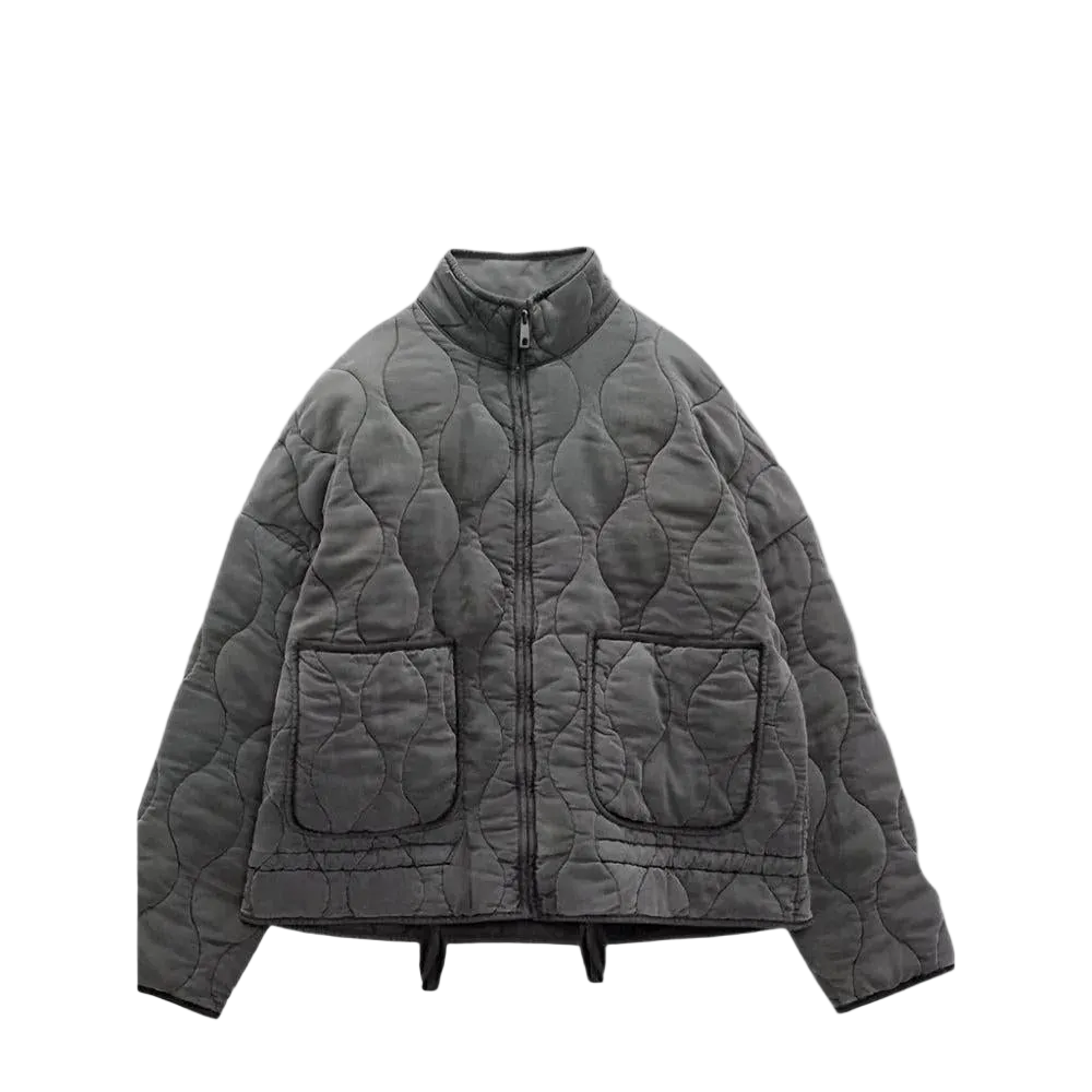 Front view of a dark gray short quilted jacket with a stand collar, zip closure, long sleeves, and two front patch pockets.