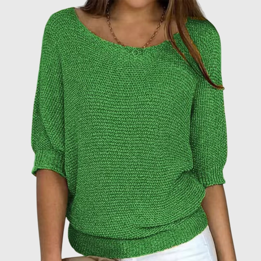 Green women’s sweater featuring a broad boat neckline and softly gathered three-quarter sleeves.