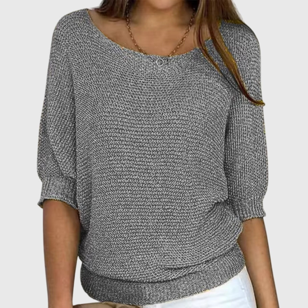 Gray relaxed boat neck sweater with ribbed sleeve cuffs and a substantial ribbed lower hem.