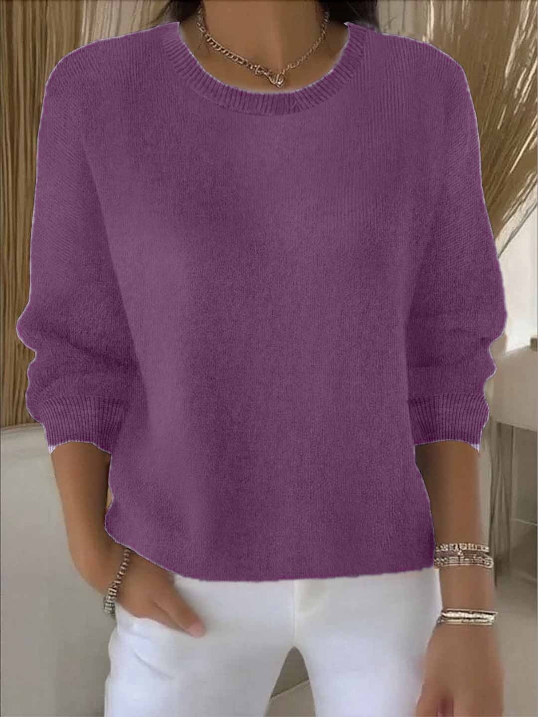 Purple relaxed crew neck sweater with long sleeves, gathered cuffs, and a clean ribbed hem.
