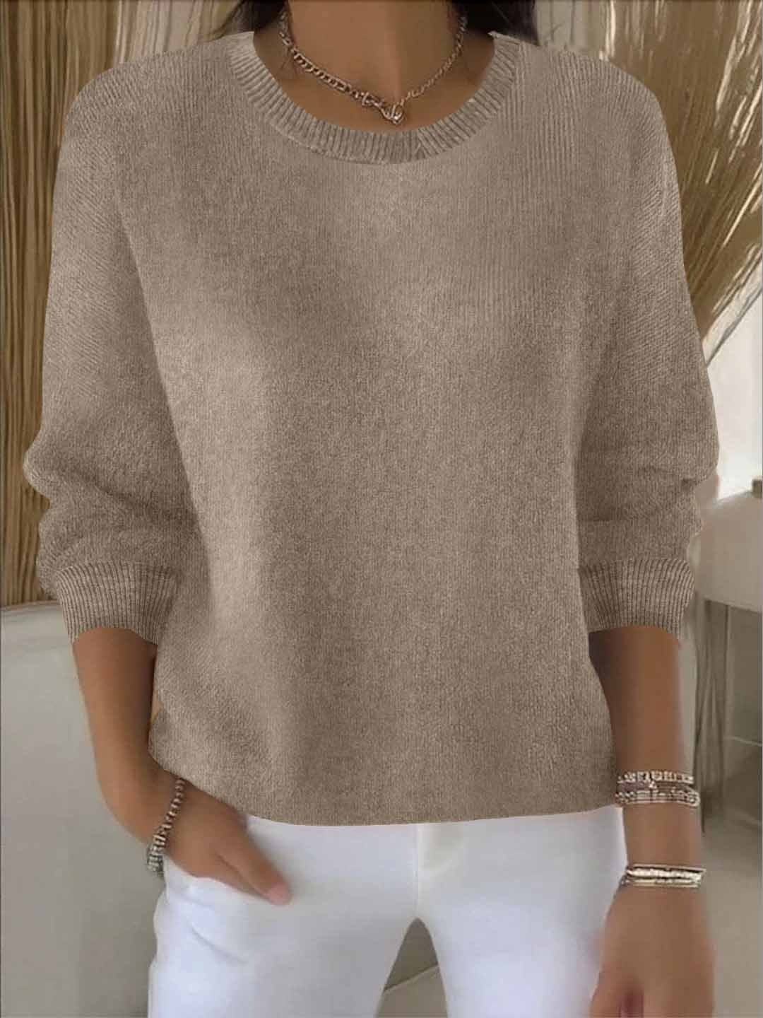 Taupe relaxed sweater displaying its crew neckline, easy shape, long sleeves, and ribbed hem.