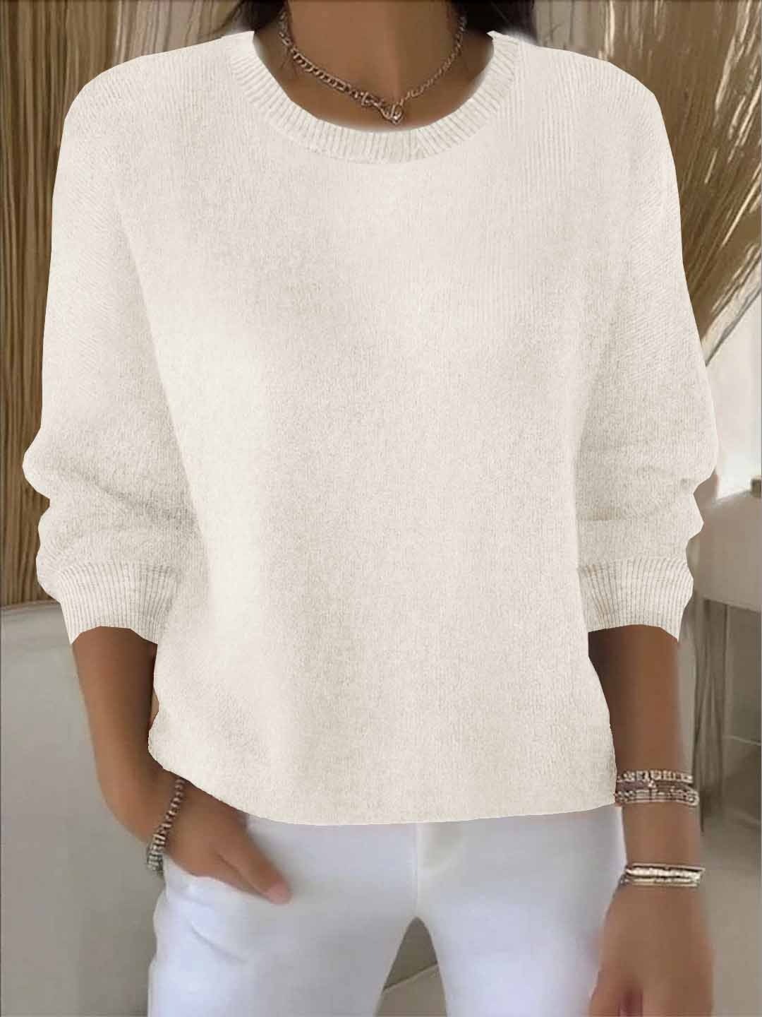 Off-white crew neck sweater in a relaxed silhouette, shown with long sleeves and defined ribbed neckline and hem.