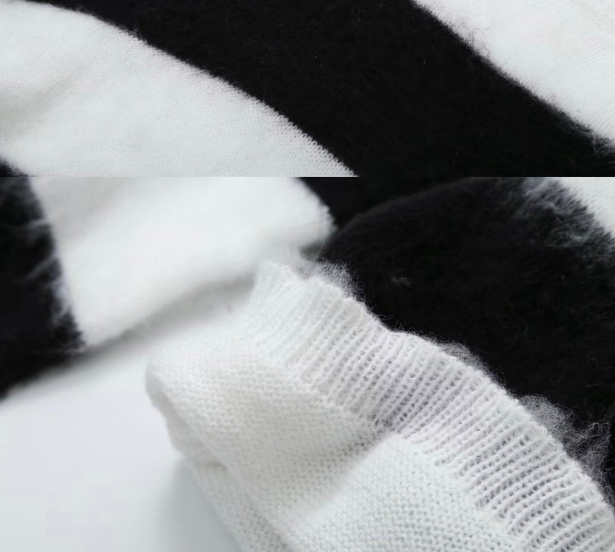 Close-up detail of a white sweater cuff against a black-and-white striped knit surface.