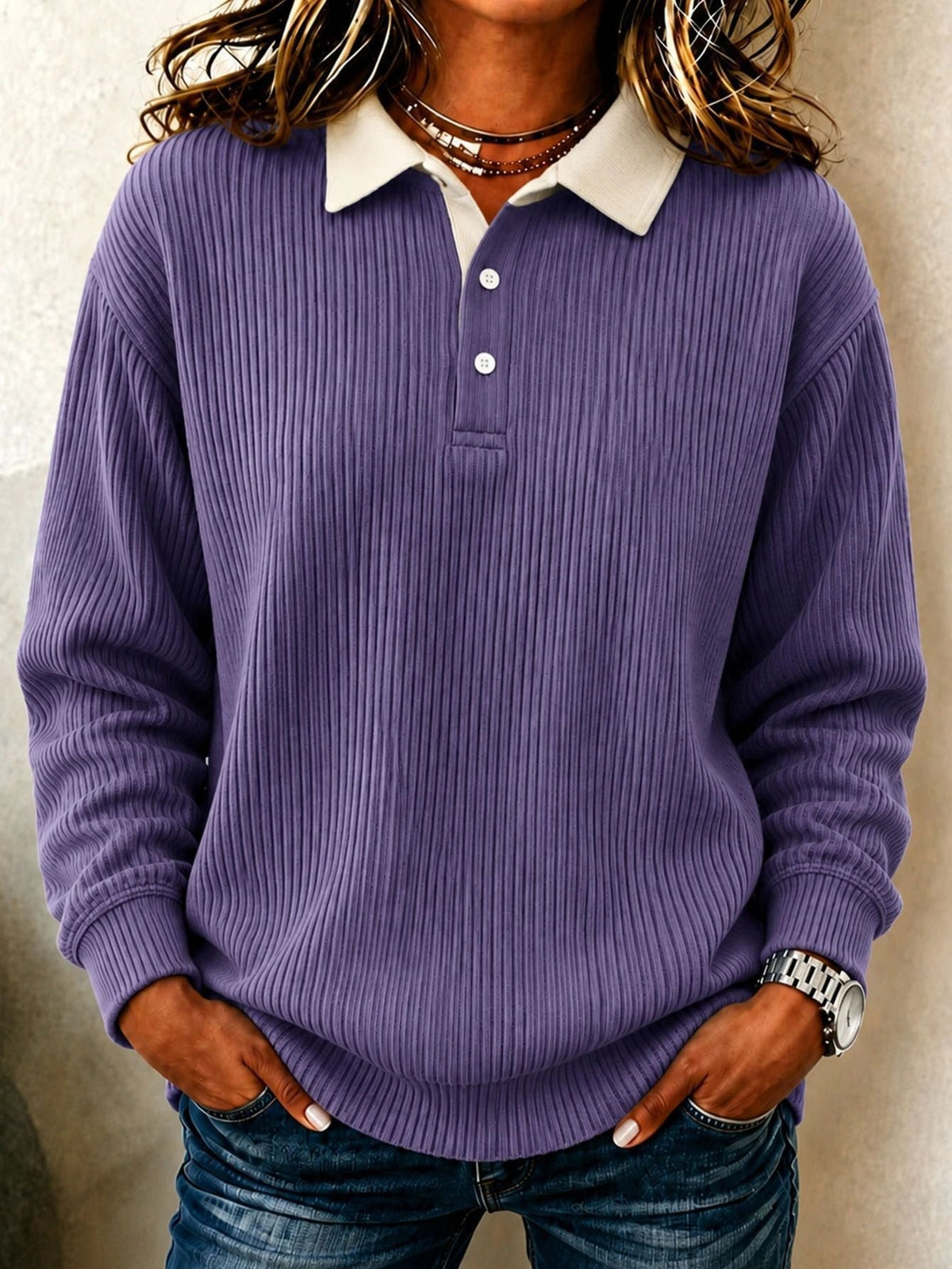 Purple ribbed polo sweater featuring a cream pointed collar, two-button placket, long sleeves, and ribbed cuffs.