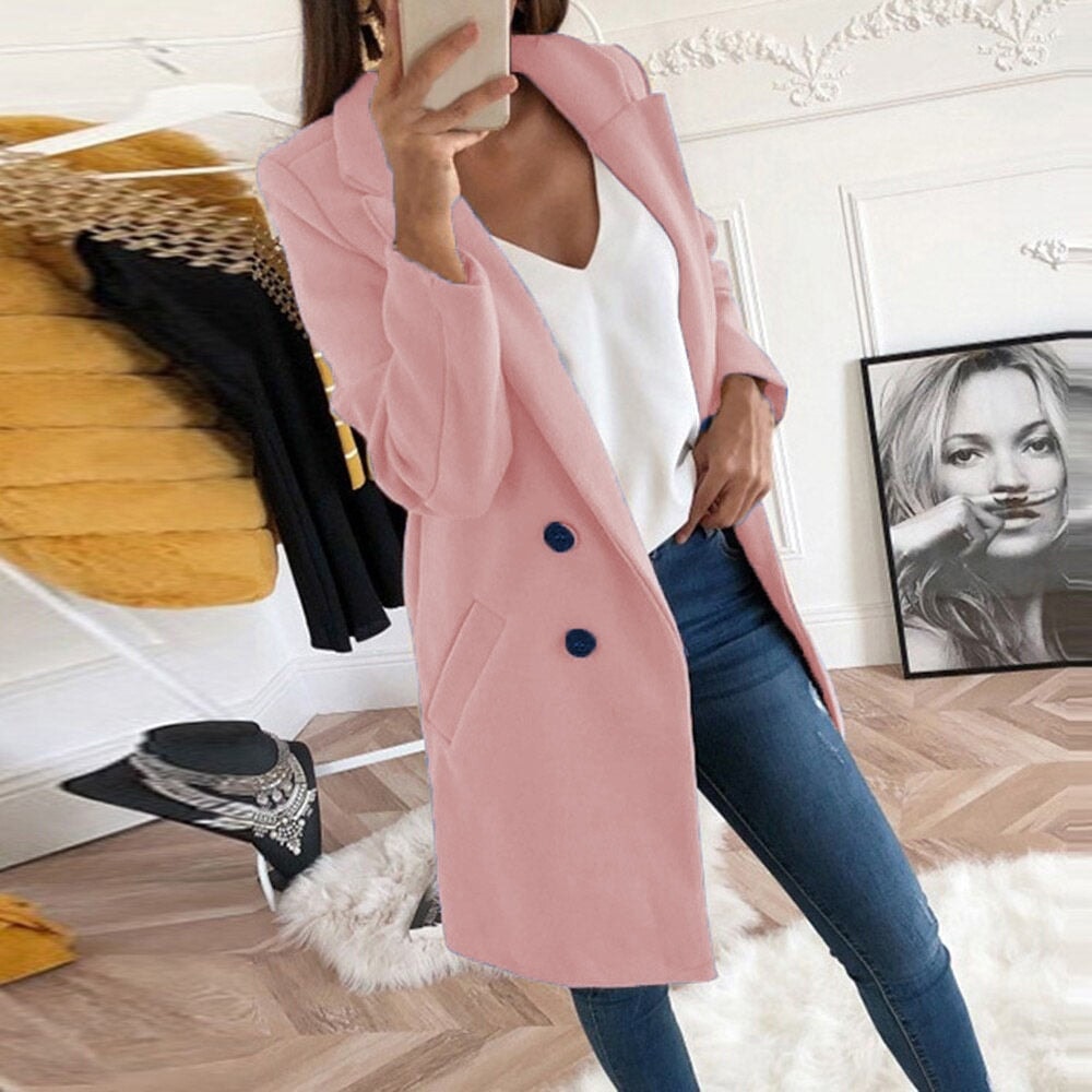 Light pink single-breasted coat with contrasting dark buttons, notch lapels, long sleeves, and an angled hip pocket.